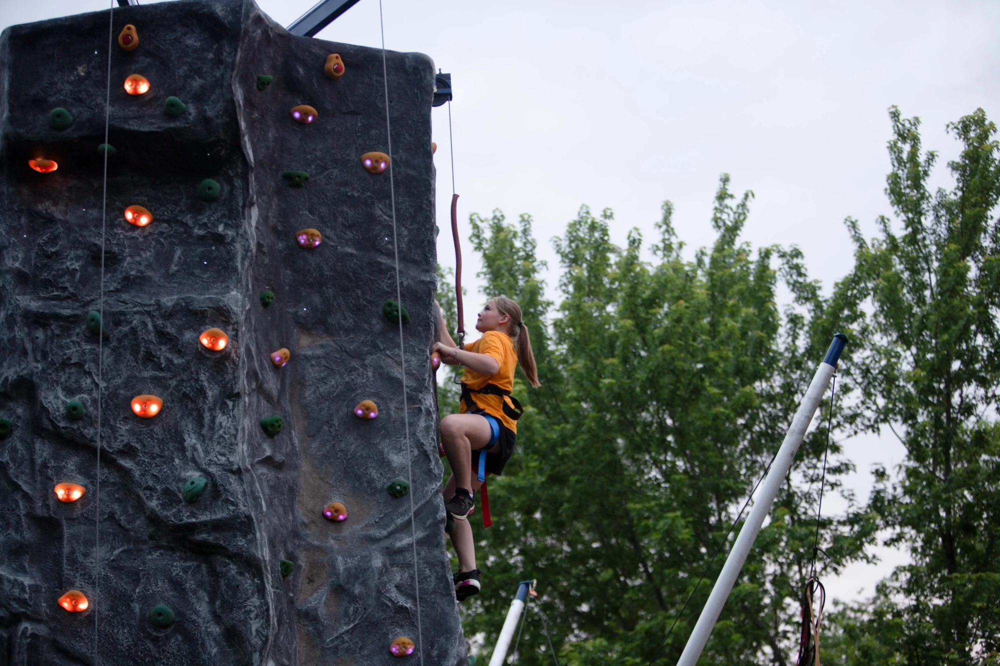 young girl rock climbing